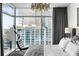 Bedroom featuring city views and modern decor, creating an open and stylish space at 45 Ivan Allen Jr Nw Blvd # 1702, Atlanta, GA 30308