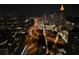 A captivating cityscape view showcases the vibrant skyline with buildings and lights at night at 45 Ivan Allen Jr Nw Blvd # 1702, Atlanta, GA 30308