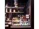 Modern coffee shop display case with sweet and savory treats, beverages, overhead shelving, and stylish lighting at 45 Ivan Allen Jr Nw Blvd # 1702, Atlanta, GA 30308