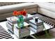 Elegant coffee table featuring curated books and a vibrant vase of flowers, adding a pop of color at 45 Ivan Allen Jr Nw Blvd # 1702, Atlanta, GA 30308