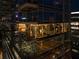 Condo exterior at night with well-lit interior spaces, showcasing luxurious urban residences at 45 Ivan Allen Jr Nw Blvd # 1702, Atlanta, GA 30308