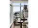 A dining room features city views, telescope, Buddha statue and light grey walls at 45 Ivan Allen Jr Nw Blvd # 1702, Atlanta, GA 30308