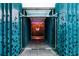 The hotel entrance features modern design elements with a distinctive leaf design along a tiled walkway at 45 Ivan Allen Jr Nw Blvd # 1702, Atlanta, GA 30308