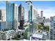 Modern high-rise condo building with glass facade, city skyline, and rooftop pool at 45 Ivan Allen Jr Nw Blvd # 1702, Atlanta, GA 30308