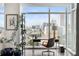 Bright home office with large windows offering city views, and a stylish desk area perfect for productivity at 45 Ivan Allen Jr Nw Blvd # 1702, Atlanta, GA 30308
