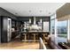 A gourmet kitchen features an island, modern appliances, and open floor plan with dark cabinets at 45 Ivan Allen Jr Nw Blvd # 1702, Atlanta, GA 30308