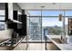 Contemporary kitchen with stainless appliances, dark cabinets, island and gorgeous cityscape view at 45 Ivan Allen Jr Nw Blvd # 1702, Atlanta, GA 30308