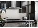 A sleek kitchen with stainless steel appliances and a granite countertop with a chrome faucet at 45 Ivan Allen Jr Nw Blvd # 1702, Atlanta, GA 30308