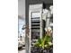 Wine storage with stainless-steel front, with views to sitting area at 45 Ivan Allen Jr Nw Blvd # 1702, Atlanta, GA 30308