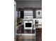 Close up on a kitchen with stainless appliances, dark cabinets, and light counter tops at 45 Ivan Allen Jr Nw Blvd # 1702, Atlanta, GA 30308