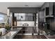 A modern kitchen featuring stainless steel appliances, dark cabinetry, and granite countertops at 45 Ivan Allen Jr Nw Blvd # 1702, Atlanta, GA 30308
