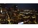 City skyline at night with bright building lights, capturing a bustling urban environment at 45 Ivan Allen Jr Nw Blvd # 1702, Atlanta, GA 30308