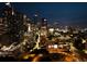 Nighttime cityscape with illuminated buildings and winding roads, presenting a captivating urban panorama at 45 Ivan Allen Jr Nw Blvd # 1702, Atlanta, GA 30308