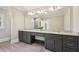 Bright bathroom with double vanity, undermount sinks, large mirror, and tile floor at 1059 Woodland Ave, Atlanta, GA 30316