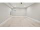 Unfinished bedroom features smooth walls, recessed lighting, and a window at 1059 Woodland Ave, Atlanta, GA 30316