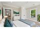 Comfortable bedroom features a neutral palette, large window with bright natural light at 1059 Woodland Ave, Atlanta, GA 30316