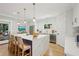 Open concept kitchen featuring an island with seating and stainless steel appliances at 1059 Woodland Ave, Atlanta, GA 30316