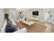 Bright and airy living room features an open floor plan, hardwood floors and modern decor at 1059 Woodland Ave, Atlanta, GA 30316