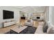 Spacious living room with stone fireplace and an open floor plan at 1059 Woodland Ave, Atlanta, GA 30316