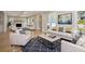 Bright, open-concept living room with hardwood floors and neutral furniture at 1059 Woodland Ave, Atlanta, GA 30316