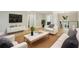 Spacious living room featuring hardwood floors, modern furniture, and ample natural light at 1059 Woodland Ave, Atlanta, GA 30316