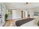 Comfortable main bedroom with a sliding barn door to bathroom, and bright natural light at 1059 Woodland Ave, Atlanta, GA 30316