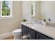 Stylish powder room with custom vanity, quartz countertop, and modern fixtures at 1059 Woodland Ave, Atlanta, GA 30316