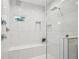 Modern shower with marble tile, a built-in bench and a rain shower head at 1059 Woodland Ave, Atlanta, GA 30316