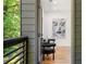 Balcony view looking into a stylish bedroom with hardwood floors, modern art and comfortable seating at 187 Clay Se St, Atlanta, GA 30317