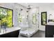 Spa-like bathroom featuring a large glass shower and a soaking tub at 187 Clay Se St, Atlanta, GA 30317