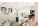 Bright dining area with a glass table and open view of the modern kitchen with marble countertops at 187 Clay Se St, Atlanta, GA 30317