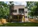 Modern two-story house with multi-tone siding, a balcony, and an inviting outdoor deck and yard at 187 Clay Se St, Atlanta, GA 30317
