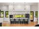 Modern kitchen with a large island, sleek cabinetry, and stylish lighting fixtures at 187 Clay Se St, Atlanta, GA 30317