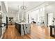 Open-concept kitchen with an island and an adjacent living space with hardwood floors throughout at 187 Clay Se St, Atlanta, GA 30317