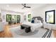 Bright main bedroom with hardwood floors, a ceiling fan, large windows, and stylish decor at 187 Clay Se St, Atlanta, GA 30317