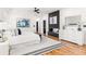 Spacious main bedroom features modern decor, hardwood floors, and a decorative fireplace at 187 Clay Se St, Atlanta, GA 30317