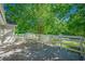 Wooden deck overlooks a lush backyard with lots of trees at 2492 Bermuda Dr, Loganville, GA 30052