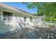 The rear of the house has a wooden deck, siding, and white trim at 2492 Bermuda Dr, Loganville, GA 30052