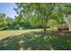 Large backyard with a deck, tree coverage and storage building at 2492 Bermuda Dr, Loganville, GA 30052