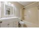 Bathroom with white vanity, mirror, and combined shower and bathtub at 2492 Bermuda Dr, Loganville, GA 30052
