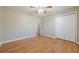 Bedroom with hardwood floors, closet and doorway with natural light at 2492 Bermuda Dr, Loganville, GA 30052