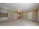 Spacious bonus room with new carpet, storage cabinets, and backyard view at 2492 Bermuda Dr, Loganville, GA 30052