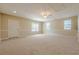 Large bonus room with neutral carpet, a ceiling fan, and a white door at 2492 Bermuda Dr, Loganville, GA 30052