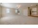 Spacious bonus room with new carpet, windows, ceiling fan, and neutral paint at 2492 Bermuda Dr, Loganville, GA 30052