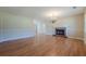 Inviting living area showcasing hardwood flooring, a cozy brick fireplace, and neutral wall colors at 2492 Bermuda Dr, Loganville, GA 30052