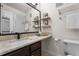 Bathroom vanity features quartz counters, black hardware, updated mirror and stylish decor at 3701 Essex Ave # 2, Atlanta, GA 30339