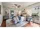 Cozy bedroom with two windows, hardwood floors, ceiling fan, and stylish decor at 3701 Essex Ave # 2, Atlanta, GA 30339