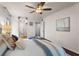 Bright bedroom with hardwood floors, a ceiling fan and a door to the bathroom at 3701 Essex Ave # 2, Atlanta, GA 30339