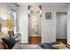 Bright bedroom with hardwood floors, a ceiling fan and a door to the bathroom at 3701 Essex Ave # 2, Atlanta, GA 30339