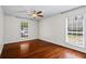 Spacious bedroom with hardwood floors, two windows, and ceiling fan at 3701 Essex Ave # 2, Atlanta, GA 30339